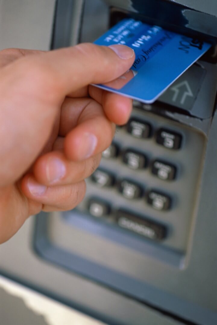 ATM card being inserted into ATM card slot